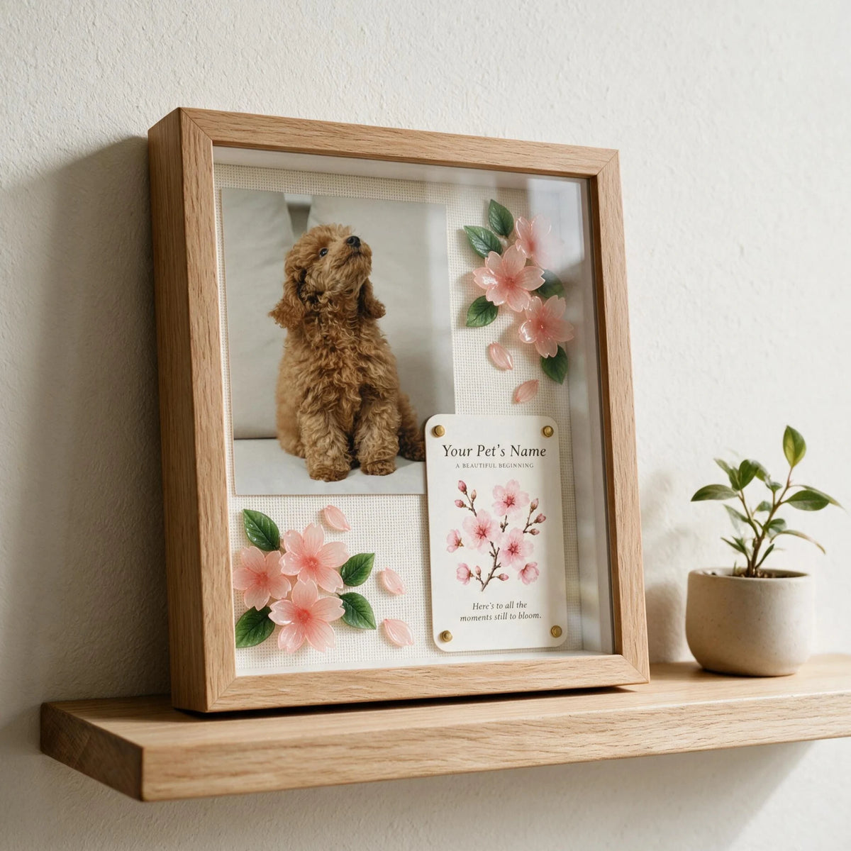 Personalized dog keepsake shadow box with a pet photo, handmade cherry blossom flowers, and a custom message card in a natural oak frame.
