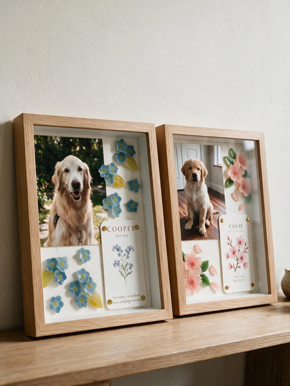 Personalized YP Pets shadow boxes featuring Cooper with blue forget-me-nots and Coco with pink cherry blossoms.